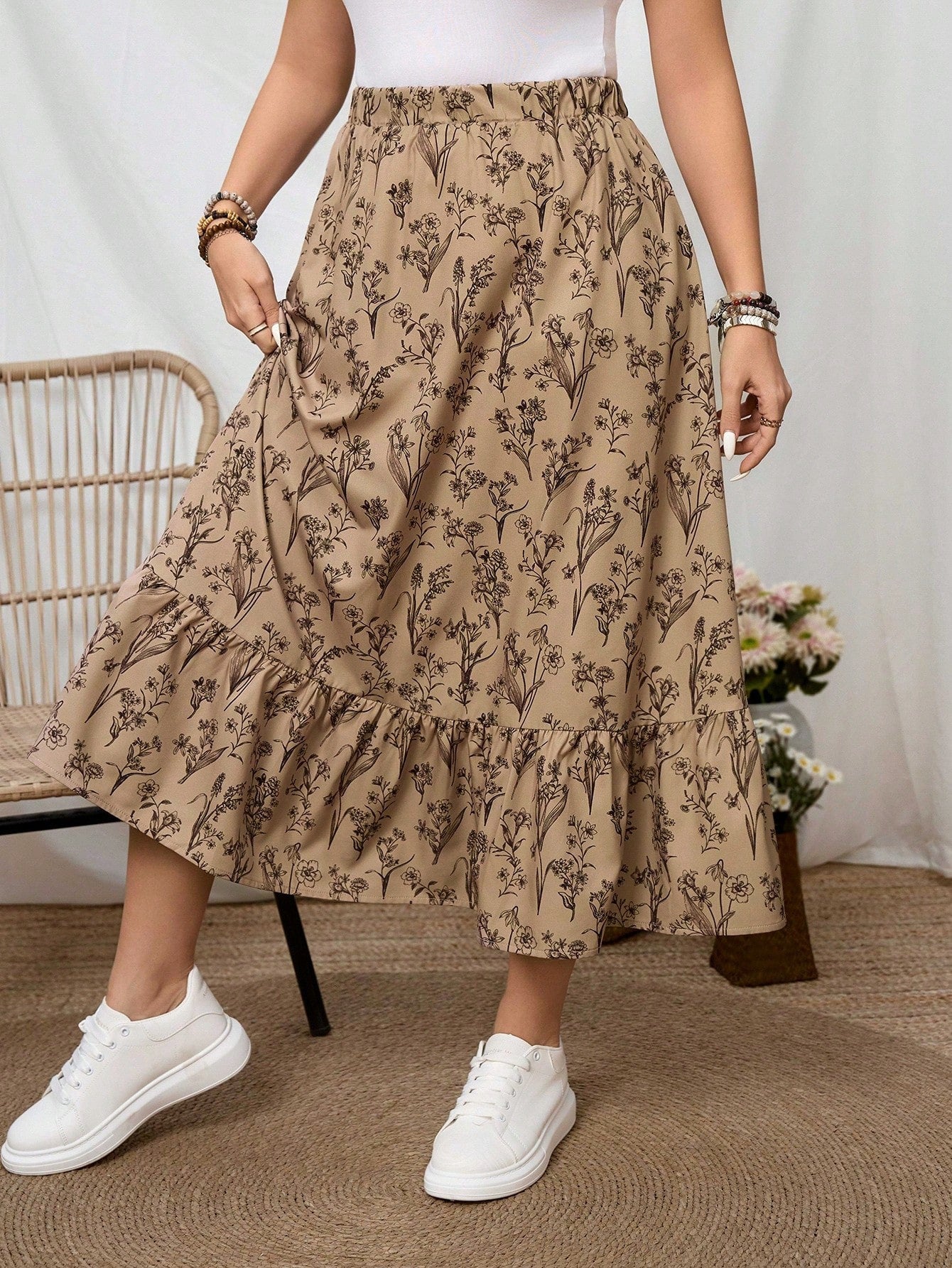 Jupe midi à imprimé floral avec taille élastique et volant fluide